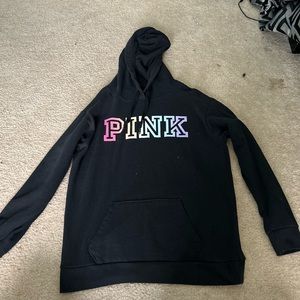 It’s a black hoodies brand it’s pink it has blue pink purple yellow green in it